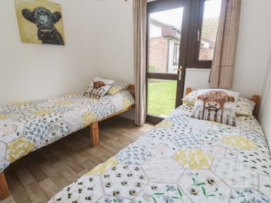 A bedroom with two single beds at Tolroy Manor Holiday Park St Erth Praze near Hayle