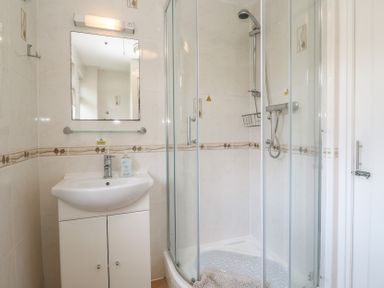 A bathroom with a shower and sink at Tolroy Manor Holiday Park St Erth Praze near Hayle