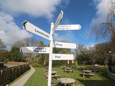 A signpost directing to various facilities at Tolroy Manor Holiday Park St Erth Praze near Hayle
