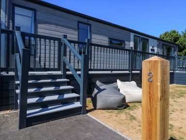 An outdoor area with stairs and bean bags at Lakewood Plot 2 St. Osyth