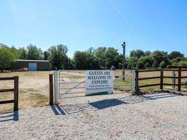 A gate with a welcome sign at Lakewood Plot 2 St. Osyth