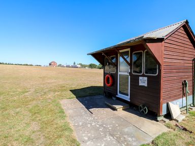 A bicycle store with a door and windows at Lakewood Plot 2 St. Osyth
