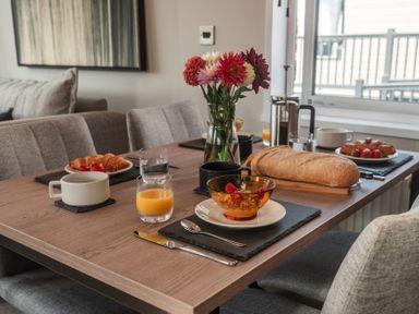 A dining room table set with breakfast items at Lakewood Plot 2 St. Osyth