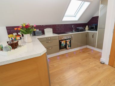 A kitchen with countertop appliances and a skylight at Cuckoo's Rest in Penryn