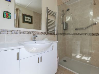 A bathroom with a sink and shower at Temple House in Goonhavern