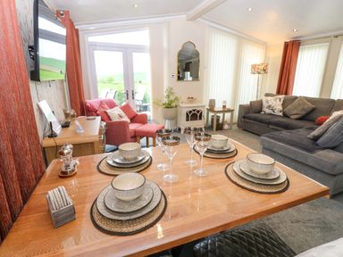 A dining area with a table and chairs at Plot 32 High Hesket near Armathwaite