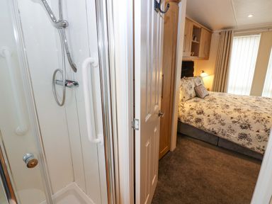 A shower and a bedroom at Plot 32 High Hesket near Armathwaite