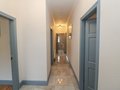 A hallway with doors and lights at No 1 Lodge Wood, Kenmare, County Kerry
