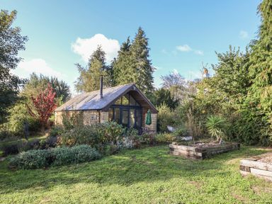 A house with garden and trees at The Cart Shed Barwick near Yeovil Somerset