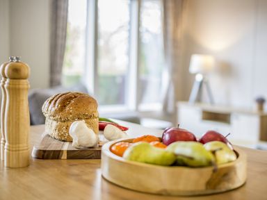 A kitchen with food items on a table at Lodge 55 at Riviera Bay Coastal Retreat, Brixham