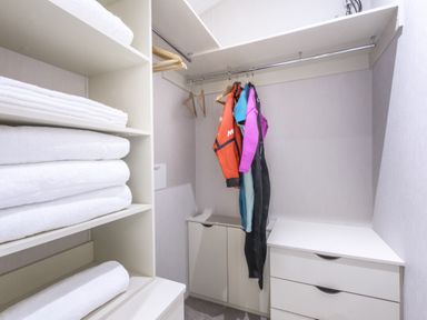 A laundry room with towels and wetsuits at Lodge 9 at Landscove Holiday Park Brixham