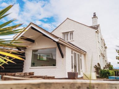 A house with a window and roof at Glanllyn Bach in Llanfaelog