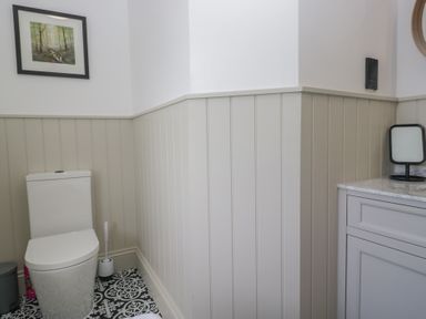 A bathroom with a toilet and sink at 5 Thornbarrow Road