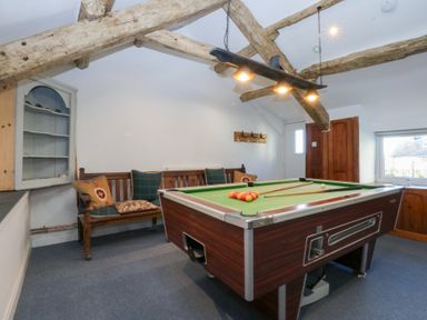 A games room with a pool table and a sofa at Yr Hen Felin in Dyffryn Ardudwy