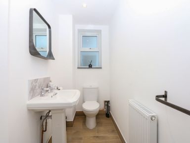 A bathroom with a sink and toilet at Yr Hen Felin in Dyffryn Ardudwy