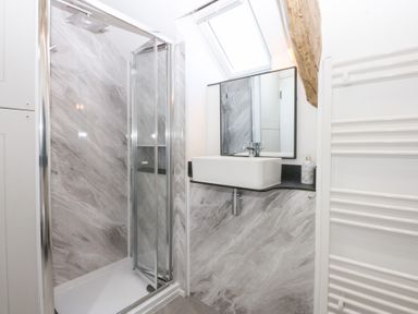 A bathroom with a shower and sink at Yr Hen Felin Dyffryn Ardudwy