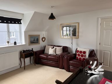 A living room with a sofa and chair at 20 Keay Heights St Austell