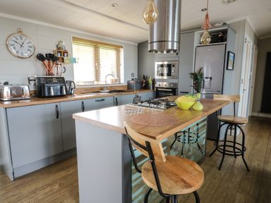 A kitchen with appliances and counter space at Coogee View in Maenygroes near New Quay