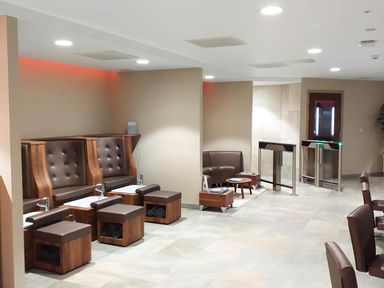 A salon area with pedicure stations and brown chairs at Lodge 47 - Primrose Lodge in Finlakes Holiday Park near Chudleigh