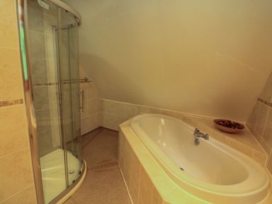 A bathroom with a corner shower enclosure and a bathtub at Lodge 58 - Oak Tree Lodge Finlakes Holiday Park near Chudleigh
