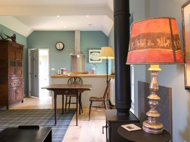 A kitchen with a table and chairs at Clock Tower in Stowmarket