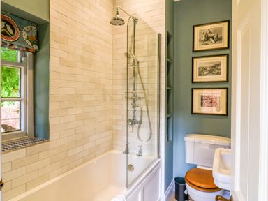 A bathroom with a bathtub and shower at Clock Tower in Stowmarket