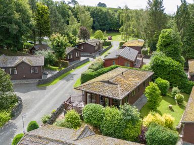An aerial view of cabins and trees at Lodge 3 At Pound Farm Crook near Kendal