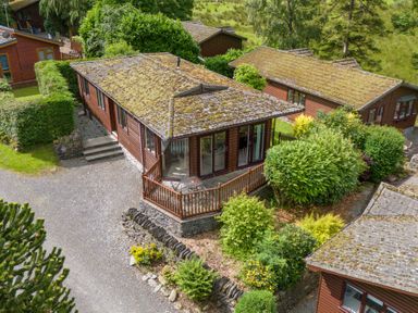 An exterior view of a cabin surrounded by greenery at Lodge 3 At Pound Farm Crook near Kendal