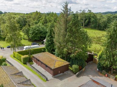 An outdoor view of Lodge 7 At Pound Farm in Crook near Kendal