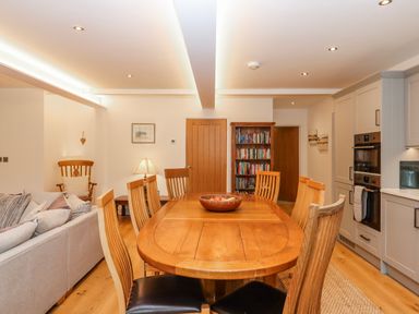 A dining area with a table and chairs at Lower Moorwood Moorwood near Bovey Tracey