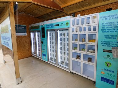 A vending machine area with local products inside cubbyholes at Folly Cottage in Llanteg near Saundersfoot