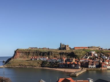 A view of houses and cliffs in Whitby at Hazel Lodge
