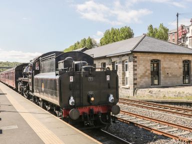 A steam locomotive at a railway station