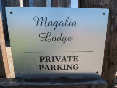 A sign for private parking at Magnolia Lodge in Whitby
