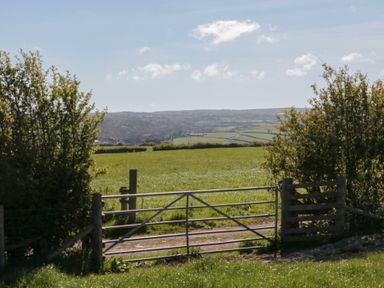 A gate opening to a field at Magnolia Lodge in Whitby