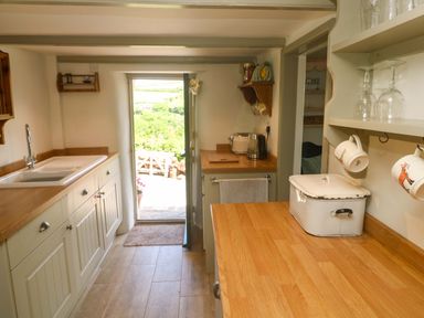 A kitchen with a sink and countertop at Greenways in Perranporth