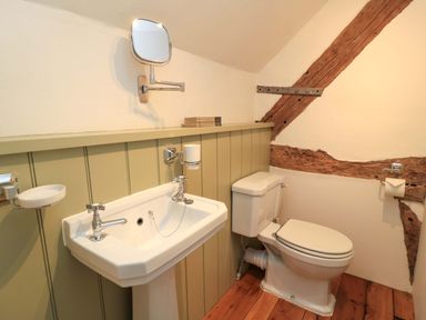 A bathroom with a sink and toilet at 8 Gloucester Street in Winchcombe