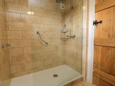 A shower area with a glass enclosure at 8 Gloucester Street in Winchcombe