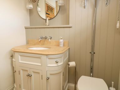 A bathroom with a sink and toilet at 8 Gloucester Street in Winchcombe