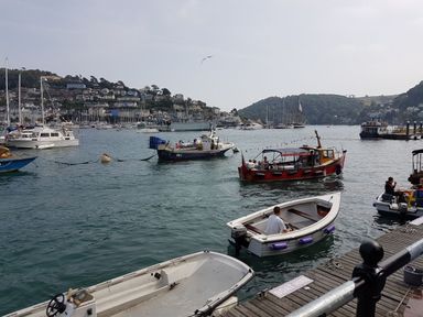 Boats in water at a harbor at Driftwood in Dartmouth