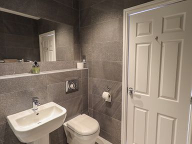 A bathroom with a sink and toilet at Waterfall in Ambleside