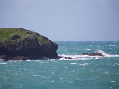 A coastal view with waves breaking on rocks at Morwenna in Mullion
