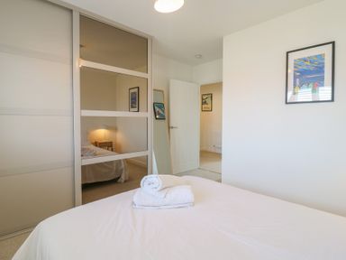 A bedroom with a bed and bedside table at Inishnee House Shotley Gate