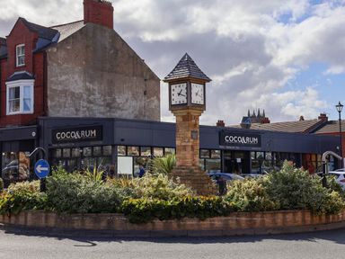 A restaurant building and clock in a public square at Ramson in Saltburn-By-The-Sea