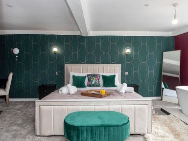 A bedroom with a bed and nightstand at Snowdonia Manor, Dolgellau