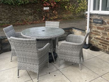 A table with chairs at Seascape in Kingsand