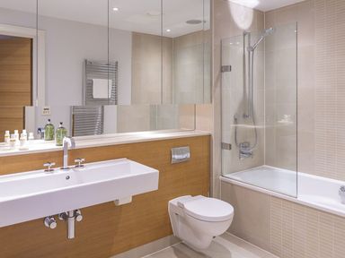 A bathroom with a sink toilet bathtub and shower at 21 Dart Marina in Dartmouth