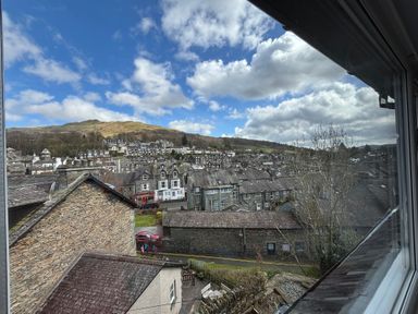 A view of houses and mountains at Rothay Cottage in Ambleside