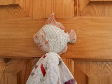 A wooden door with a ceramic fish-shaped hook holding a towel at Knockbrack in Lonart near Killorglin County Kerry