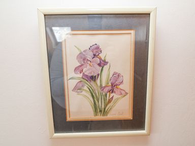 A framed watercolor painting of purple flowers on a wall at Knockbrack in Lonart near Killorglin County Kerry